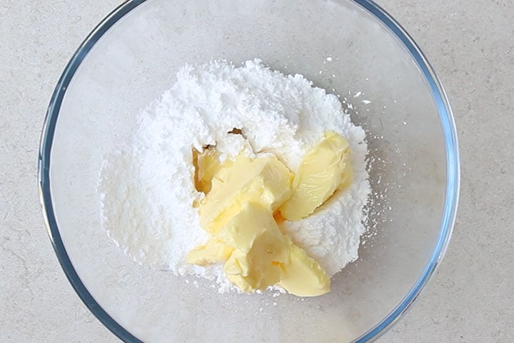 the butter, sugar and vanilla added to a mixing bowl.