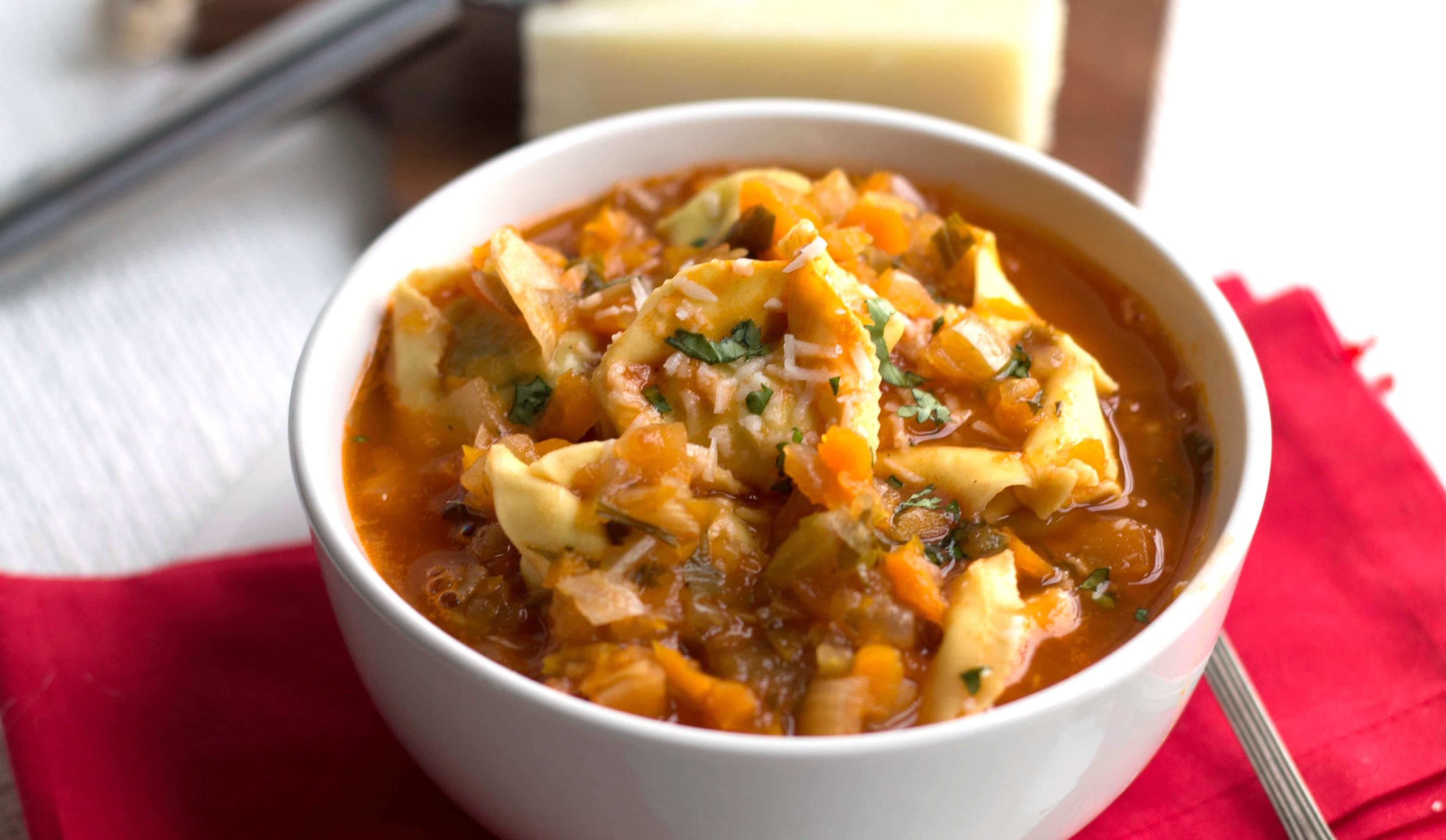 A bowl of hearty tortellini vegetable soup