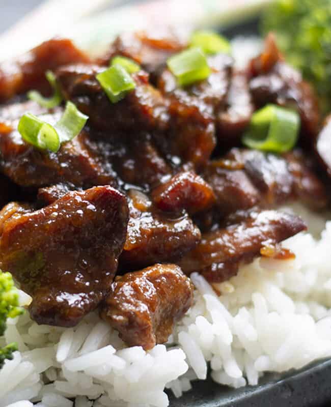 Slow Cooker Honey Soy Chicken on a bed of white rice with chopsticks