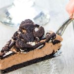 A slice of no bake Oreo cheesecake being served