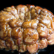 A close up of monkey bread with caramel drizzle