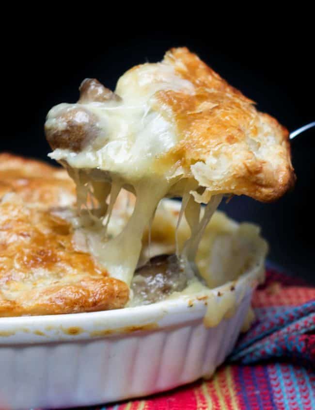 a peice of Cheesy Chicken & Mushroom Pie being served