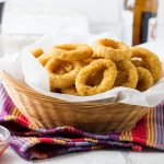 This recipe for Skinny Seasoned Baked Onion Rings from Erren's Kitchen makes a simple side dish of homemade and low fat onion rings that's so much healthier than fried - this version has a spiced breadcrumb coating that will make it a new family favorite.