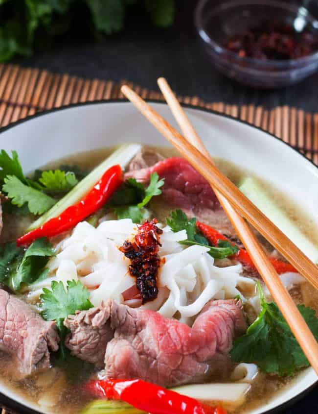 Vietnamese Beef Noodle Pho in a bowl with chopsticks