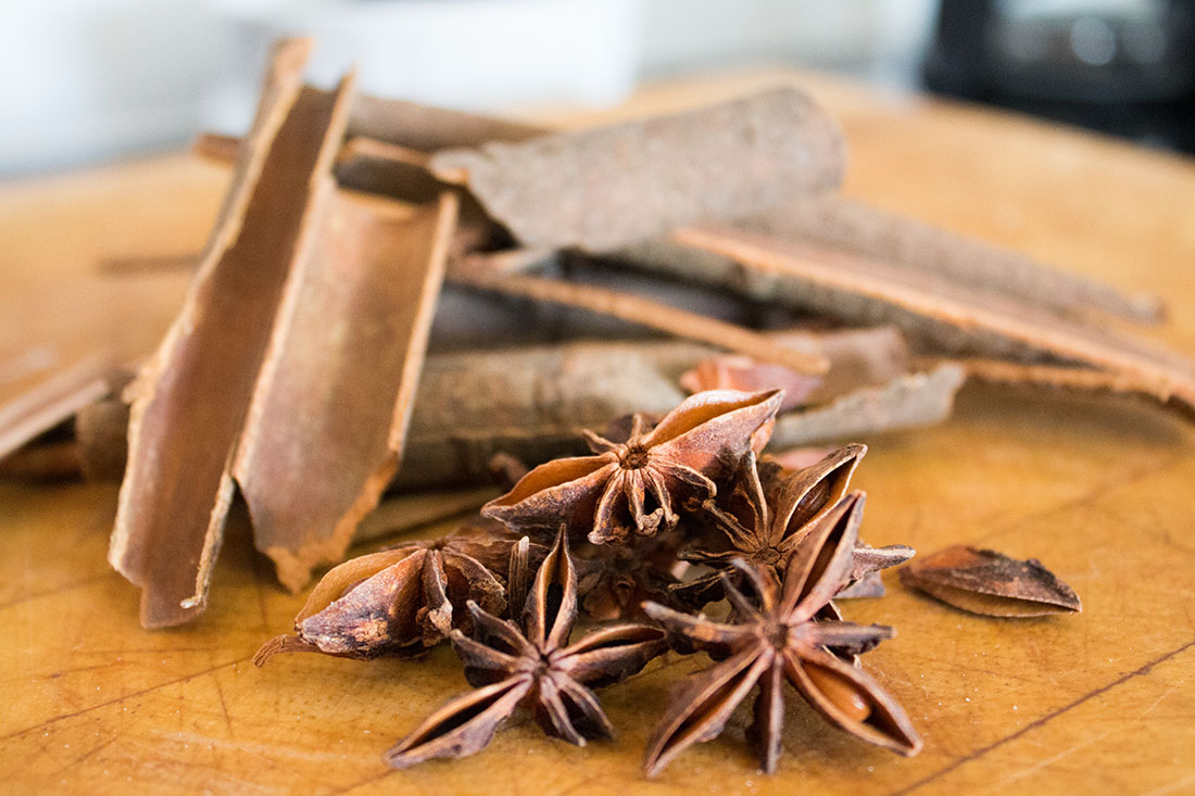 cinnamon sticks and star anise on a wooden board