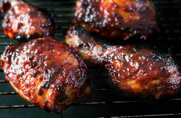 Roasted Red Pepper Barbecue Sauce covered chicken on a  baking rack