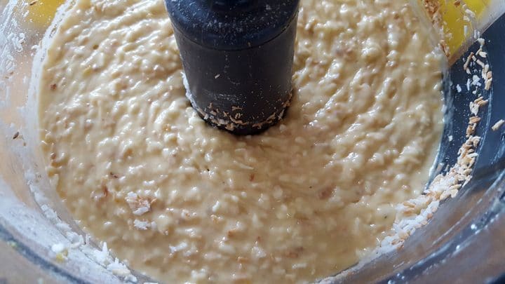 The butter and egg mixture combines with the coconut and coconut milk in a mixing bowl