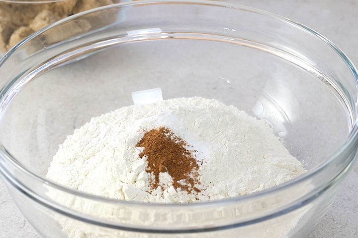 A glass bowl with the dry ingredients sifted into it