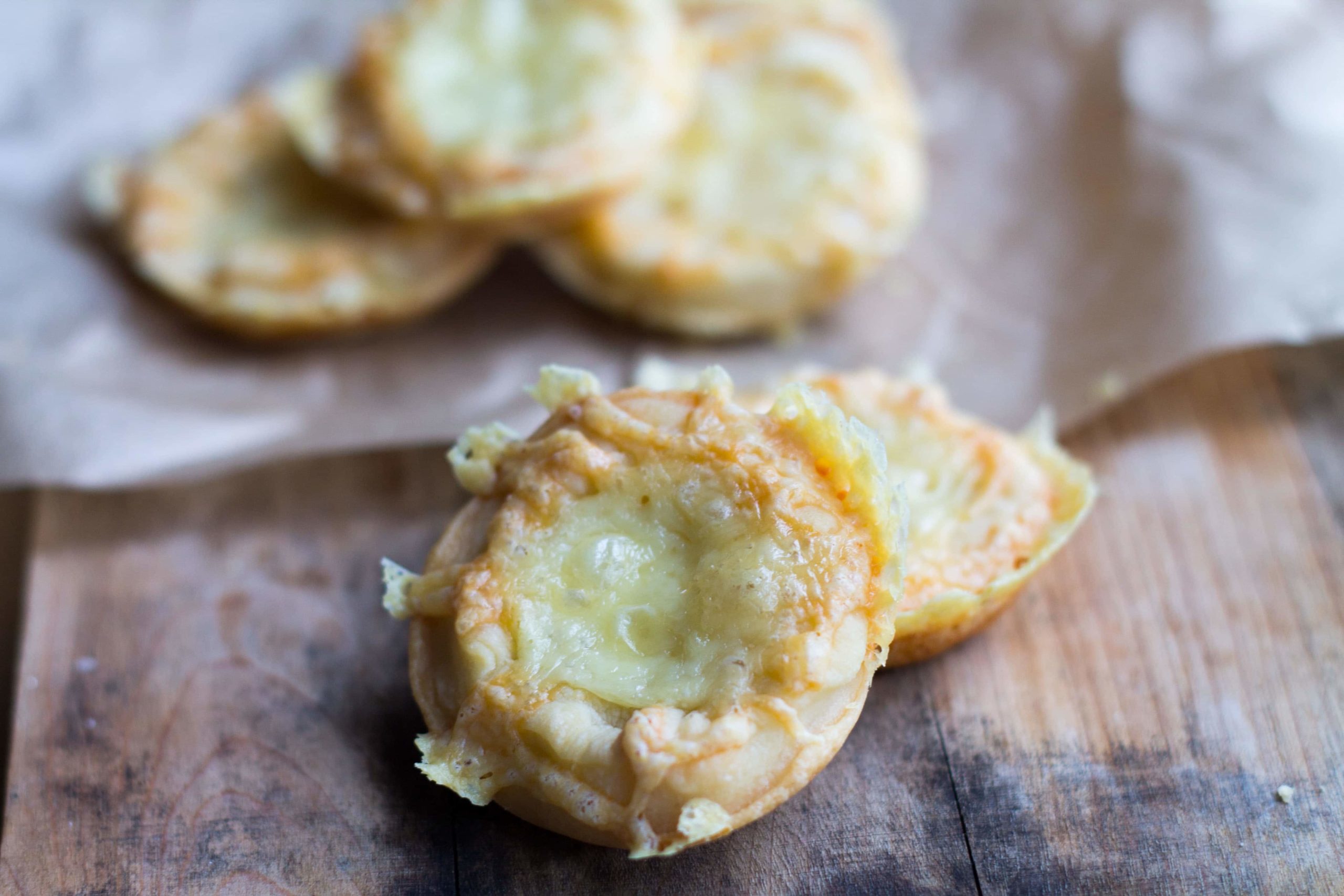 Easy Cheesy Party Snacks served on a wooden board