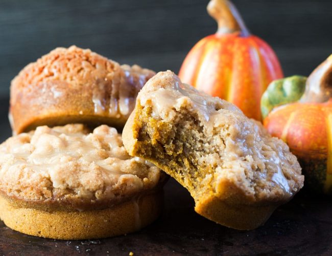 Mini Coffee cakes stacked with a bite out of one of them.