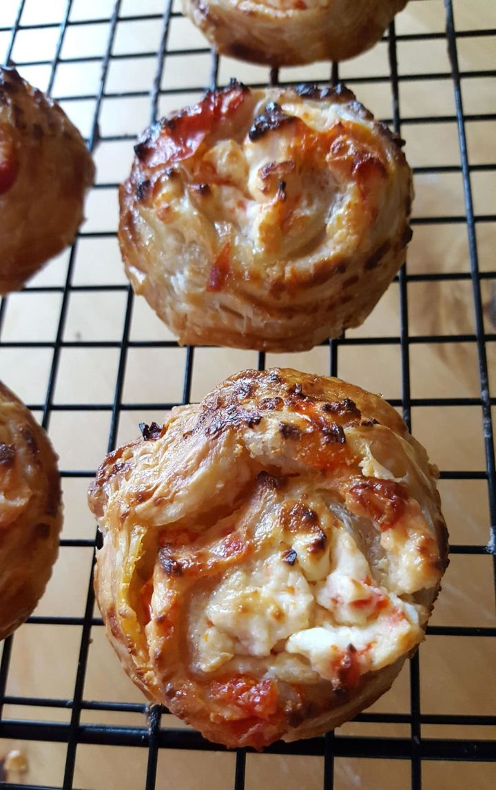 Feta & Sweet Pepper Pastry Swirls out of the oven cooling on a rack