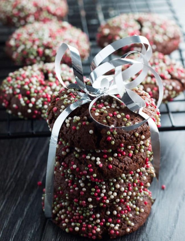 chocolate cookies tied with ribbon and decorated with sugar sprinkles