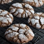 This recipe for Spiced Ginger Crinkle Cookies are ideal for holiday baking. These gingerbread flavored crinkle cookies are full of flavor, chewy, and coated in sugar to reveal their crinkle cookie cracks.