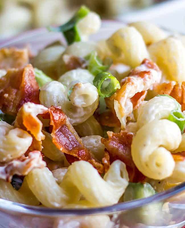 a bowl of pasta salad with bacon