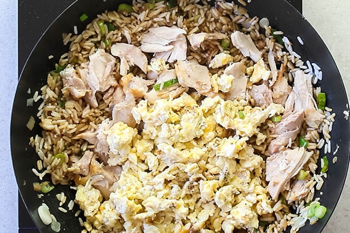 The meat and egg added to the fried rice.