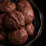 A close up of a Chocolate hazelnut cookies piled on a silver platter