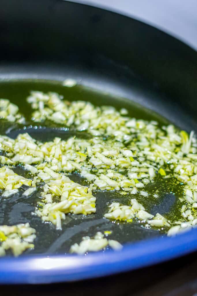 The garlic cooking in the pan