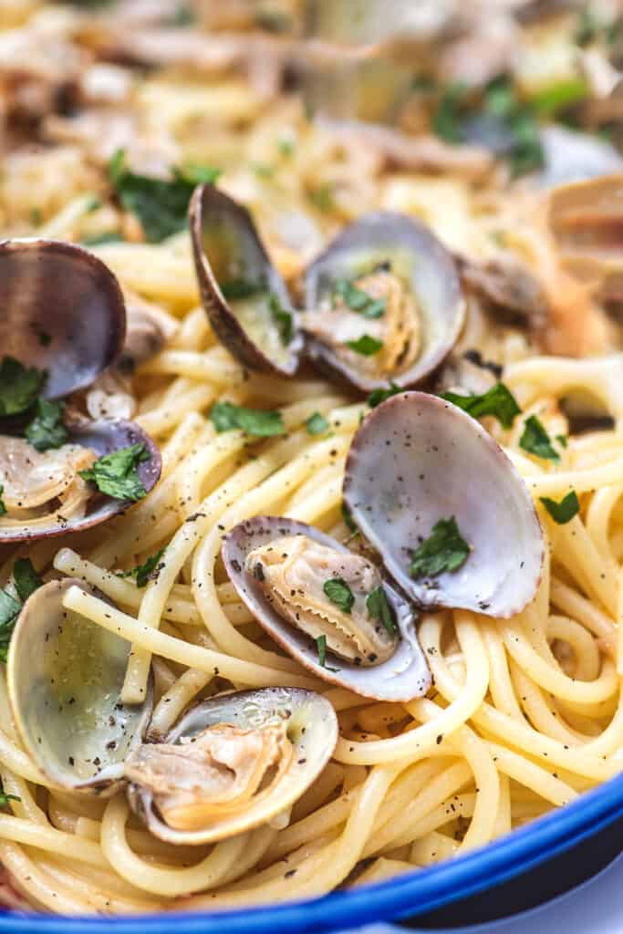 the spaghetti added to the pan with the clam sauce