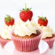 Three fresh strawberry cupcakes a