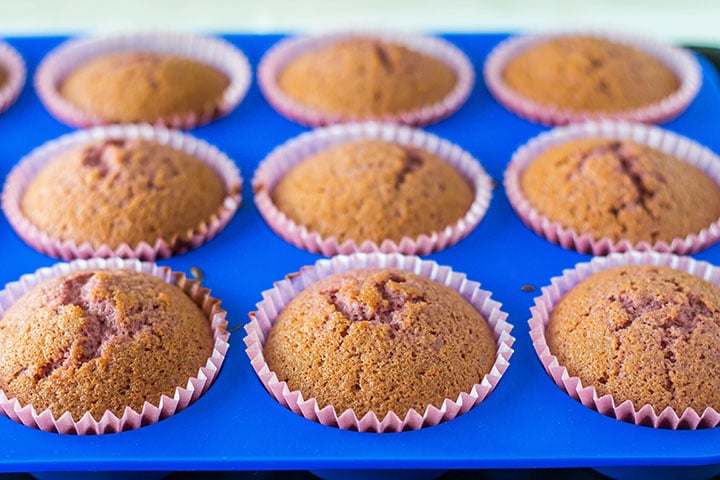 The baked cupcakes still in the pan 