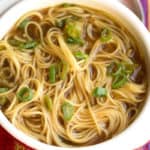 Chinese Noodle Soup in a bowl with sliced green onions on top