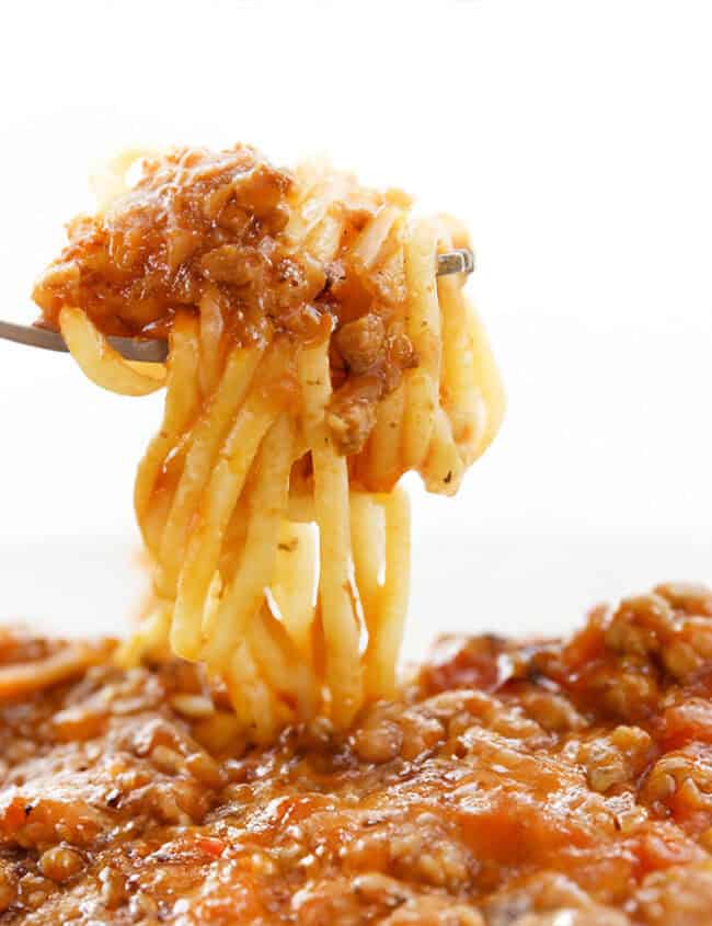 A forkful of Quick & Easy Spaghetti Bolognese ready to eat.