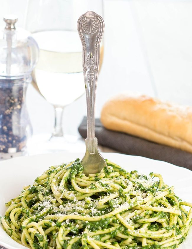 A plate of food on a table, with Sauce and Spaghetti