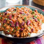 Classic Chili Con Carne served on a bed of white rice.