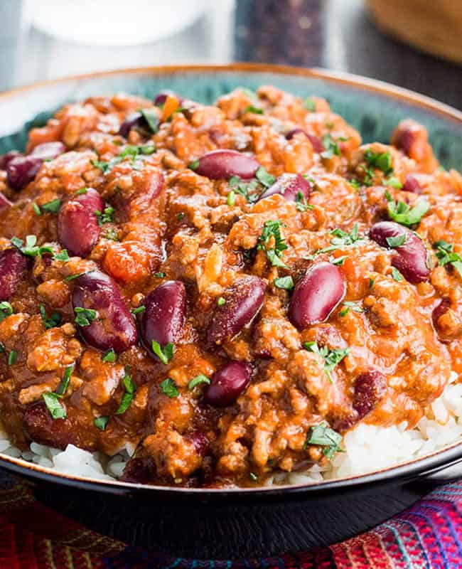 Classic Chili Con Carne served on a bed of white rice.