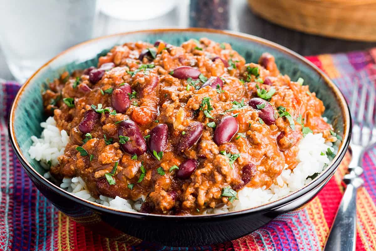 Classic Chili Con Carne served on a bed of white rice.