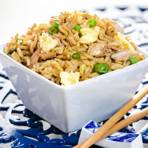 Looking for a quick and delicious meal? Try our Chicken Chopper Rice  recipe! Cooked in a savory sauce, served over fluffy rice with a half-fry  egg. Garnished with spring onions for extra