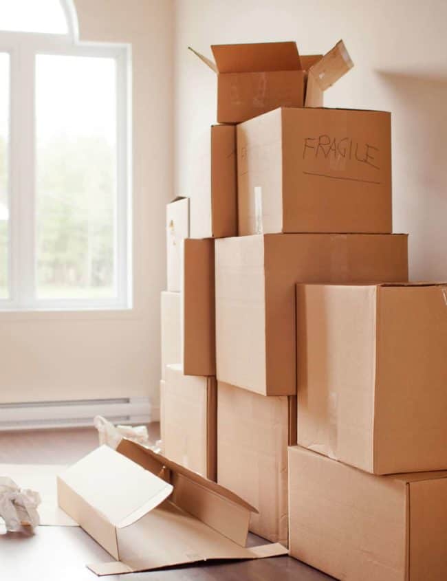 a picture of boxes stacked in an empty room