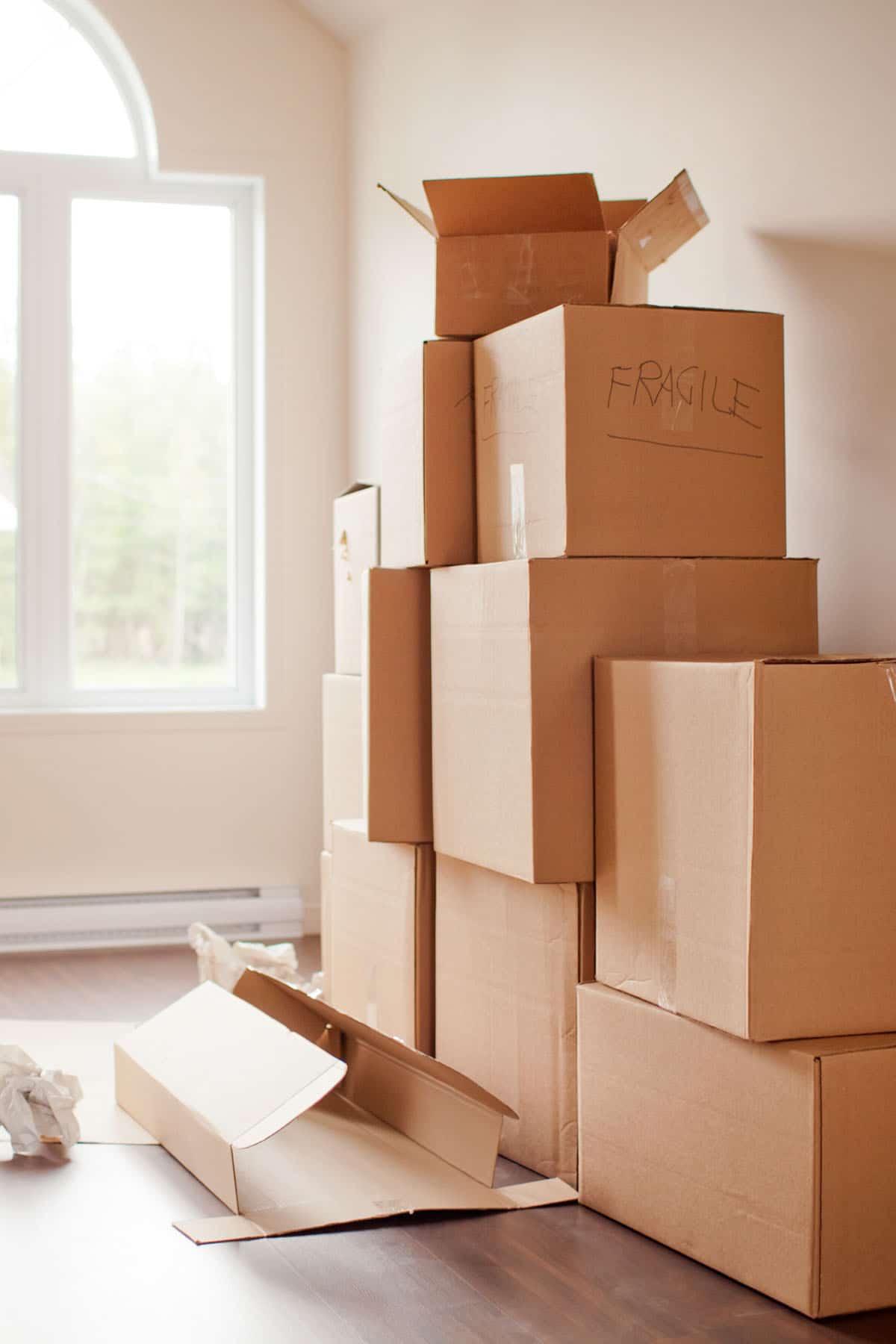 a picture of boxes stacked in an empty room