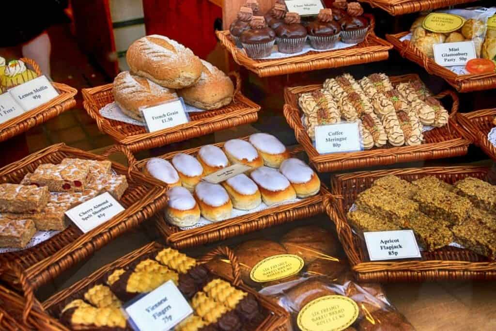 a British bakery display with pastries and flapjacks