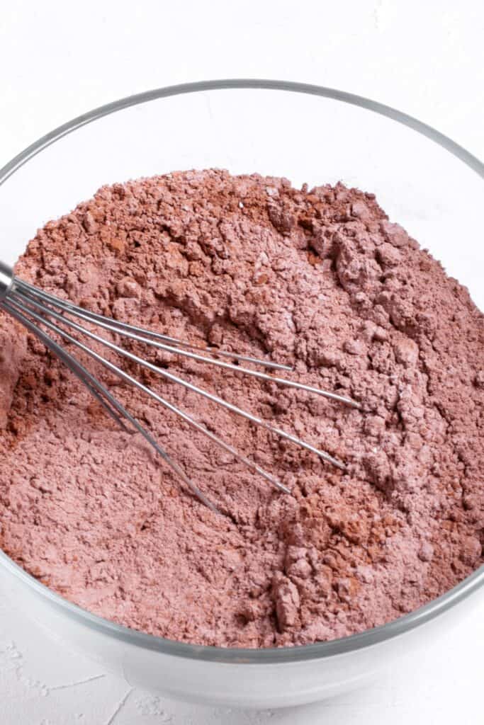 a bowl with the mixed dry ingredients for Christmas Oreo Cookies