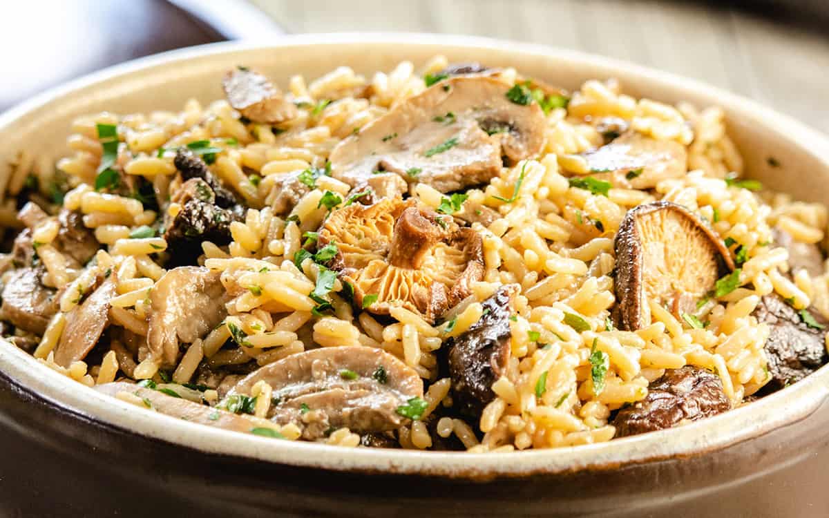 a close up of easy mushroom rice pilaf in a serving dish