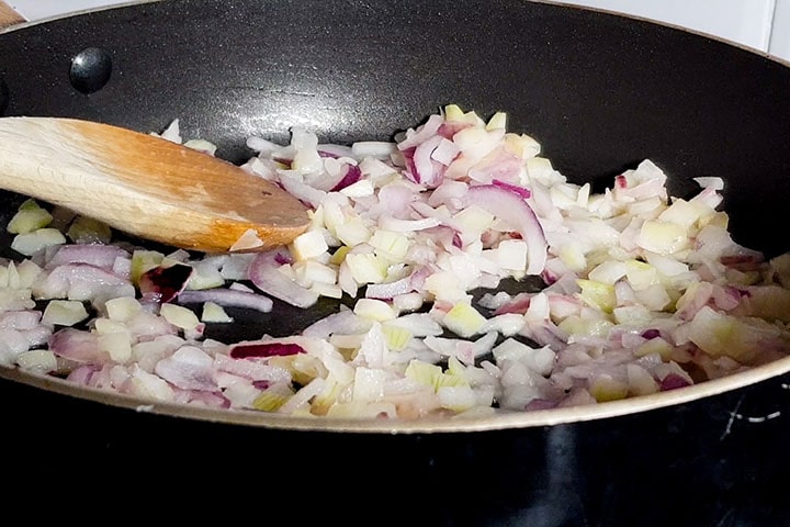 chopped onions cooking in a pan