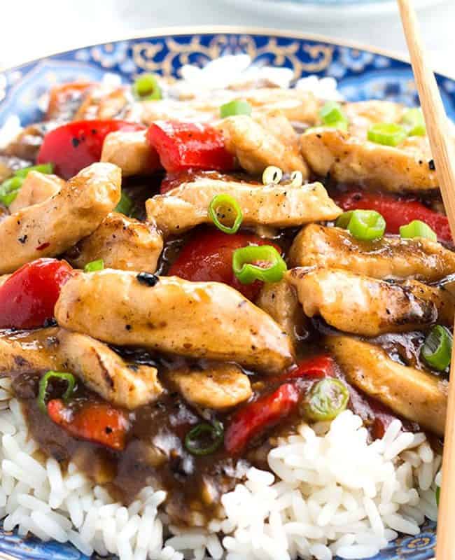 Chicken with Black Bean Sauce piled high on a bed of rice