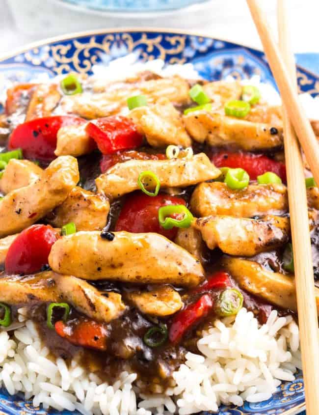 Chicken with Black Bean Sauce piled high on a bed of rice