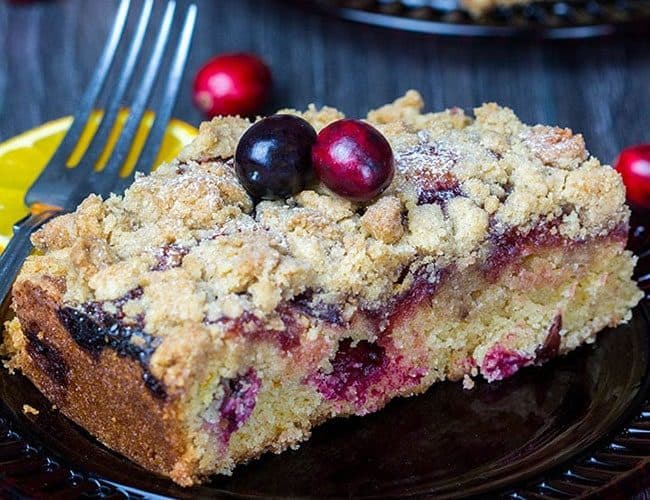 Cranberry and Orange Crumb Cake on a red plate with a fork