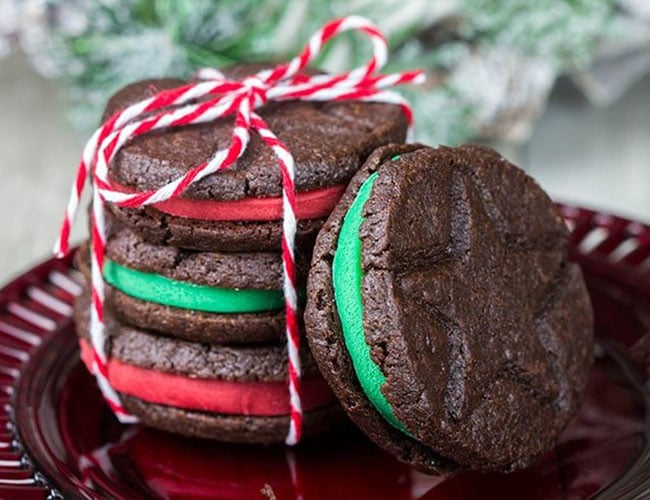 A stack of Homemade Oreo Christmas Cookies with one leaning against them