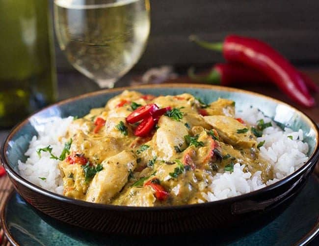 Thai Panang Chicken Curry on a bed of steamed rice and garnished with red chillies