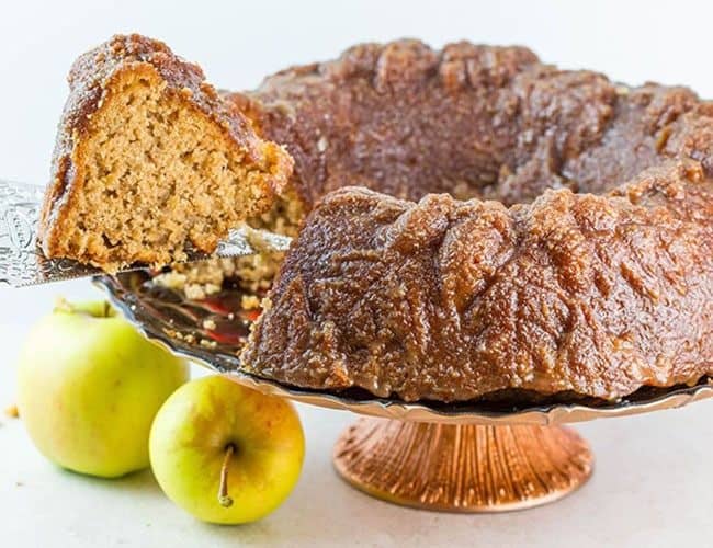 Caramel Apple Bundt Cake being served with a cake slice