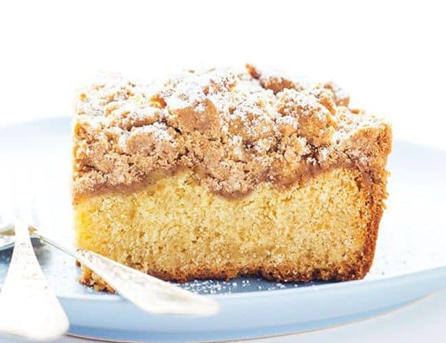 New Jersey Crumb Coffee Cake piled high with crumb topping and topped with powdered sugar