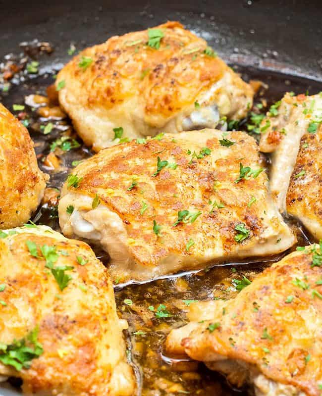 Baked Garlic Chicken Thighs with crispy skin in a pan