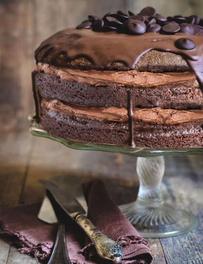 Chocolate cake with chocolate buttercream with a rustic background.