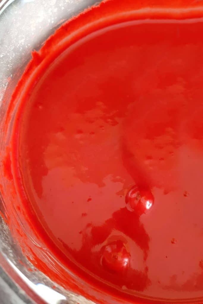 red cake batter in a bowl