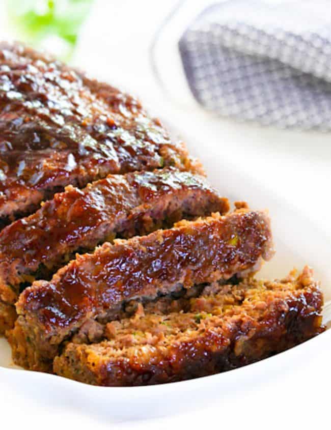 a sliced meatloaf on a serving dish