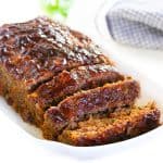 a sliced meatloaf on a serving dish