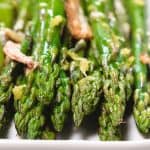 a close up of roasted aspargus on a plate